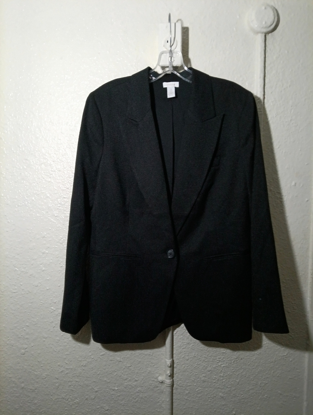 Chico's black blazer with a classic design and a single button closure